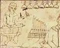 Early 12th century, France/England. Musician playing monochord and cymbala, next to a pipe organ, from B.18, folio 1r, PSALTERIUM TRIPLEX, St John's College Cambridge.