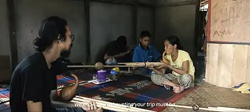 Musicians playing keluri mouth organs, Engkurai, Borneo