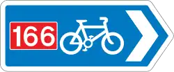 Rectangular, blue traffic sign with a white bicycle symbol and a red square with the number 166 in it.
