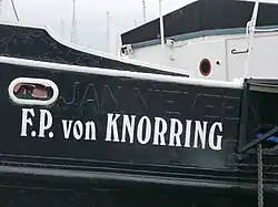 Side of the ship, with its original name painted over
