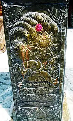 Nāga on copper pillar in Kullu, Himachal Pradesh India
