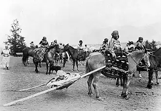 Riding horse with travois, Canada 1922