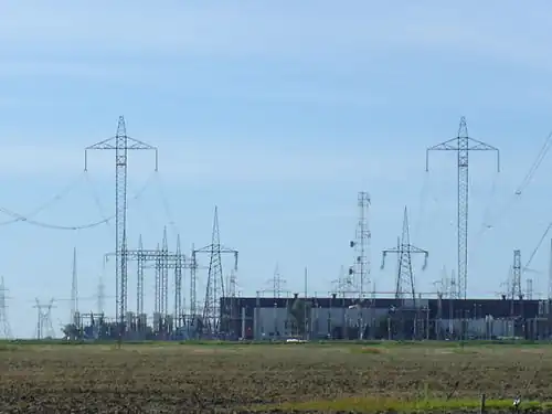Nelson River Bipoles 1 and 2 terminate at Dorsey Converter Station near Rosser, Manitoba. The station takes HVDC current and converts it to HVAC current for re-distribution to consumers