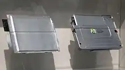 Individual cell (left) and packaged battery or "module" (right), Tokyo Motor Show (2009)