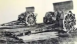 Two mortars with Bonagente grousers. A pit could be dug beneath the breech for high-angle fire.
