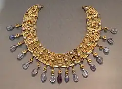 Collier; late 6th–7th century; gold, an emerald, a sapphire, amethysts and pearls; diameter: 23 cm; from a Constantinopolitan workshop; Antikensammlung Berlin (Berlin, Germany)[125]