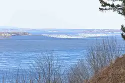 View of snow geese on the river from the village