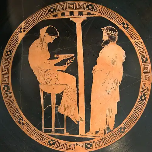 Oracle of Delphi, red-figure kylix, Kodros Painter, depicting Pythia with a cup presumably holding water from a spring, 440–430 BC