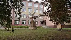 Monument to the mill next to Oryol SAU Multidisciplinary College building