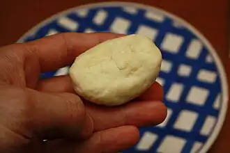 Completed raw dumpling the size of a child's fist