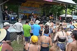 Talisk performing in an outdoor bandshell