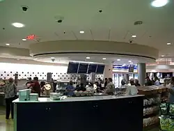 Patrons waiting in line to receive their orders.