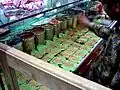 Shopkeeper making paan in an Indian store