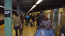 Southbound Fourth Avenue Line platform in 2007. There is a sign on a column with the Fourth Avenue Line station's old name, Pacific Street.