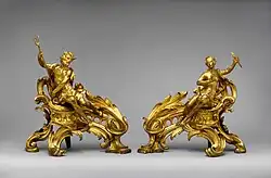 Pair of French Rococo andirons; circa 1750; gilt bronze; dimensions of the first: 52.7 × 48.3 × 26.7 cm, of the second: 45.1 × 49.1 × 24.8 cm; Metropolitan Museum of Art (New York City)