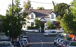 "Main Street, Raheny, with old schoolhouse turned restaurant"