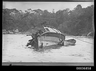 Hull section of the Greycliffe dragged to Whiting Beach.