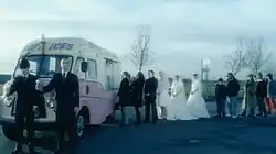 Neil Tennant, Chris Lowe and extras queueing for an ice cream van