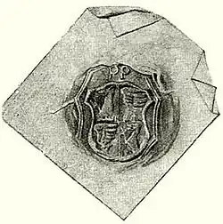 A seal representing a coat of arms divided into four parts, two of them depicting a wing, and the other two depicting a lion.