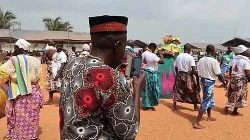Procession and a photographer.