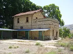Former railway station of Al-Hamma, with a sign in Arabic reading "al-Hama".[1]