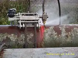 Pipe abrasive water jet cutting