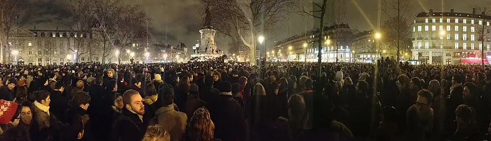 Demonstrators gather at the Place de la République in Paris on the night of the attack