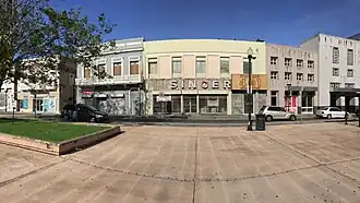 Historic buildings and TU Río Piedras station entrance in Plaza La Convalecencia across Ponce de León Ave.