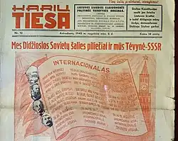 Soviet propaganda newspaper in Lithuanian language. Black text in the right square says: The Stalinist Constitution's sun already shines to the Lithuanian land and so our hearts rejoice by singing in honor of the great Stalin.