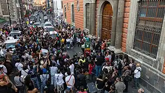 A crowd gathers at a protest