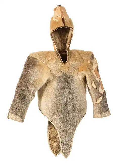 A fawn-brown and grey waist-length fur cape, with long sleeves and a hood