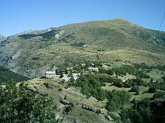 The village of Rabou and the summit of Puy, at 1,834 m (6,017 ft)