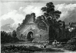 The tower in the early 19th century with the manor house on the right prior to its demolition.