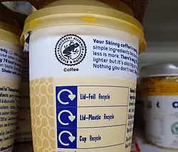 The Rainforest Alliance certification seal on a cup of coffee.