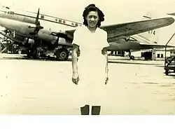 Rebecca Chan Chung at Longhua Airport, in front of a CNAC Curtiss C-46 (c.1947)