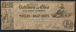 Note inscribed No. 121 Baltimore February 10, 1841 Baltimore and Ohio RAILROAD COMPANY. Transfer to the holder of this order TWELVE AND A HALF CENTS in the Stock of the City of Baltimore bearing Six per cent interest payable quarterly when said holder presents orders amounting to One Hundred Dollars or upwards. [Commissioners holding the Stock to redeem these orders]." The note is illustrated with an illustration of two standing women on the left, and one sitting woman on the right.