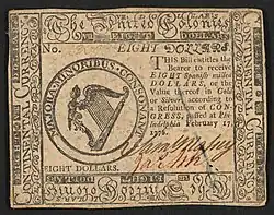 A 1776 eight-dollar banknote featuring the "United Colonies" name with the inscription ""EIGHT DOLLARS. THIS Bill entitles the Bearer to receive EIGHT Spanish milled DOLLARS, or the Value thereof in Gold or Silver, according to a Resolution of CONGRESS, passed at Philadelphia February 17, 1776." ; Within border cuts: "Continental Currency" and "The United Colonies". ; Within circle: "MAJORA. MINORIBUS. CONSONANT". ; Verso: "EIGHT DOLLARS. PHILADELPHIA: PRINTED BY HALL & SELLERS. 1776."