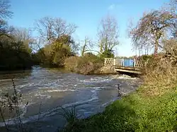 One of two overflow weirs that pass under bridges along the island