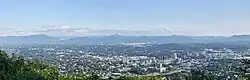 A panorama of Roanoke from the Mill Mountain Star overlook with the Blue Ridge Mountains in the background.