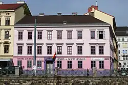 A large pink and white house.