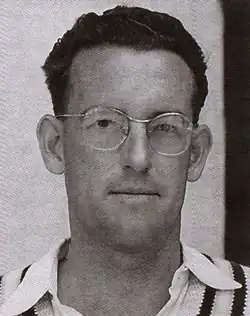 A black and white photo of a male face