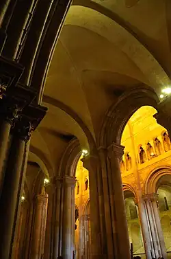 Lateral aisles covered by groin vaults.