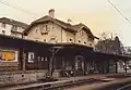 Station building with railway tracks in 1989