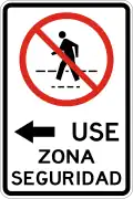 R-11-1a No pedestrian crossing, use safety zone to the left