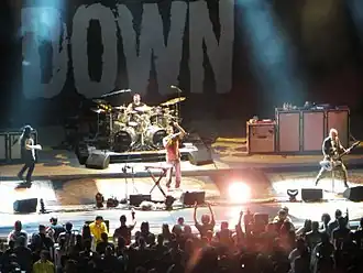 System of a Down performing in Wantagh, New York, in 2012. From left to right: Daron Malakian, John Dolmayan, Serj Tankian, and Shavo Odadjian.