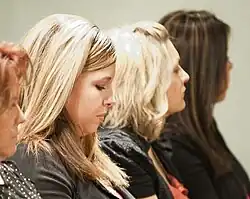 Image 63American women with popular early 2010s hairstyles, including chunky highlights, flat-ironed layers, and deep side parts with crown volume, 2012. (from 2010s in fashion)