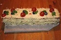 Side view of an elongated smörgåstårta