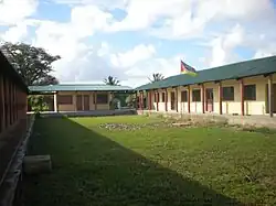 Classrooms as well as the school's cantina and supplies shop (at the end of the block).