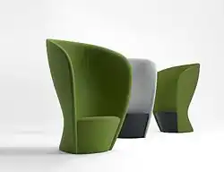 An upholstered lounge chair designed for privacy in public spaces, designed by Busk-Hertzog in 2011.