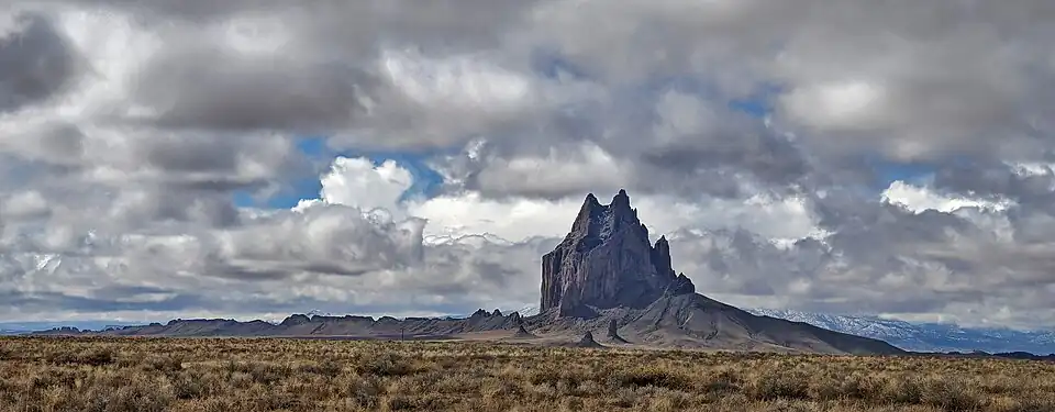 Shiprock formation in New Mexico, USA showing the 5-mile-long dike radiating to the south.